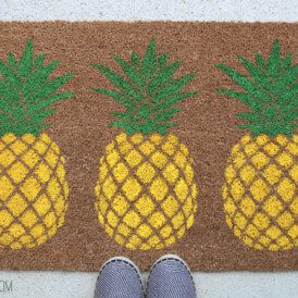 What a fun summer decoration! DIY Pineapple Doormat was so easy with a DIY stencil.